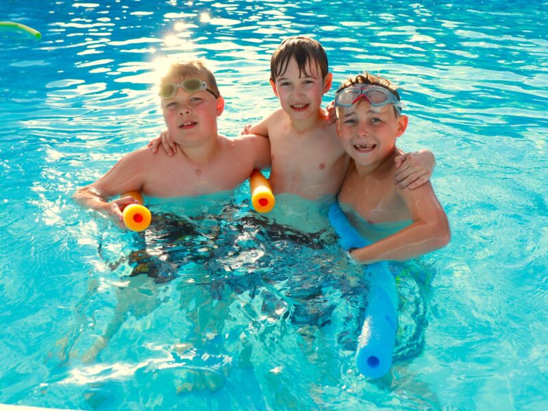 3 campers playing in the pool