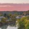 View of Elkader, Iowa, with pink clouds and beautiful fall foliage.