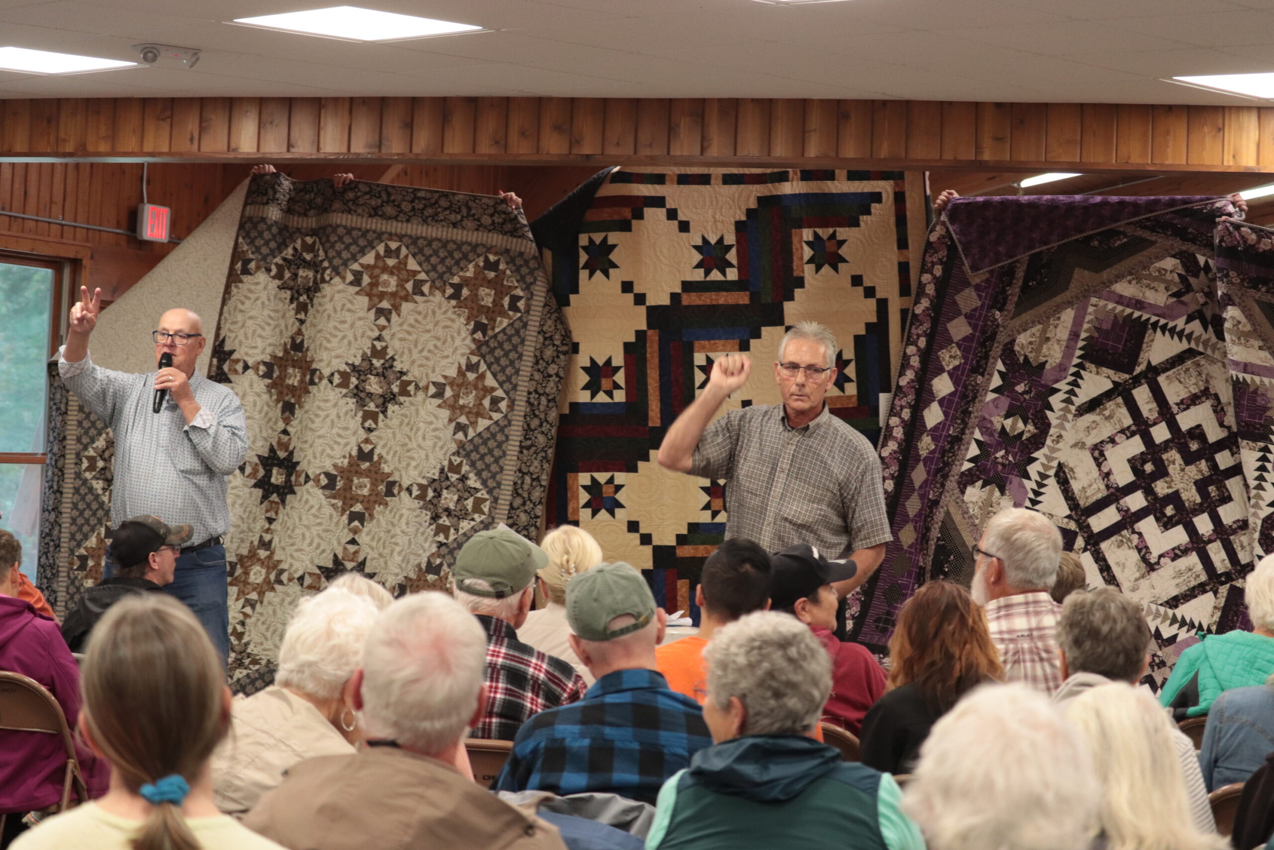 The Top 3 People's Choice Award winning quilts are presented to bidders at the Ewalu Quilt Auction in 2026.